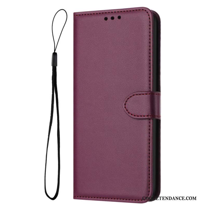 Housse iPhone 16 Plus Style Cuir Uni à Lanière